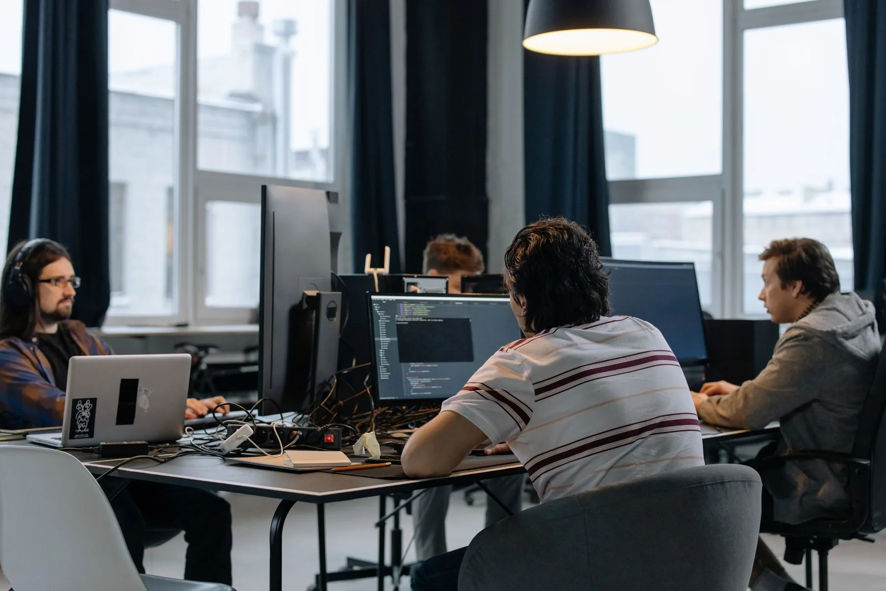 Software engineers working together in a production development environment